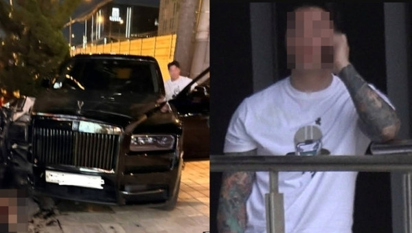 서울 강남 압구정역 인근에서 롤스로이스 차량을 운전하다 인도로 돌진해 20대 여성을 크게 다치게 한 20대 남성 신모씨가 차에서 걸어 나와 통화를 하고 있다. 사진=유튜브 채널 ‘카라큘라 탐정사무소’ 캡처